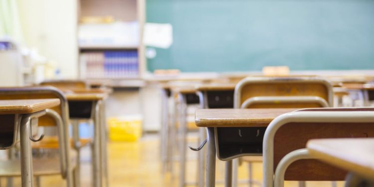 An empty school classroom defocused.